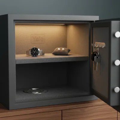 Yale Smart Safe interior with light, shelf, and valuables organized for protection